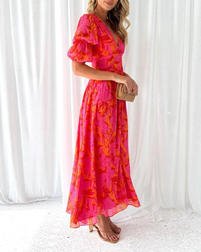 Maritza | Rosa-Orange Maxi Kleid mit Blumenmuster & Puffärmeln – Sommerlich, Schwungvoll & Unwiderstehlich