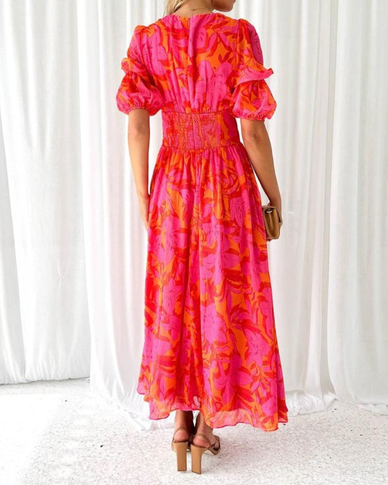 Maritza | Rosa-Orange Maxi Kleid mit Blumenmuster & Puffärmeln – Sommerlich, Schwungvoll & Unwiderstehlich